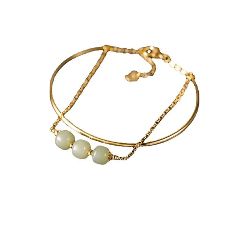 Women's Hetian jade lucky bracelet with gold inlay in single, double, and three bead styles.