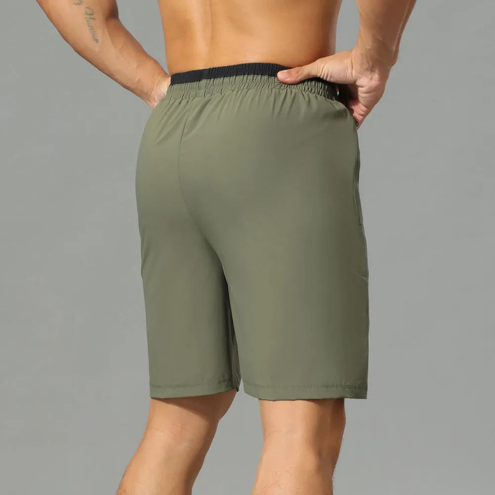 Men's loose grey Ice Silk cropped running pants on a plain background.