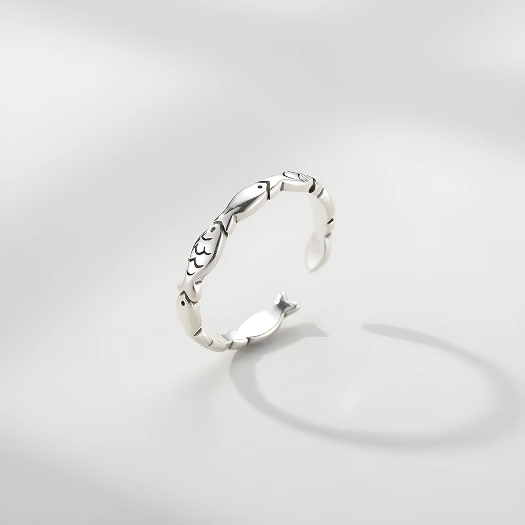 Women's adjustable sterling silver fish ring with carp zodiac design and open mouth sizing
