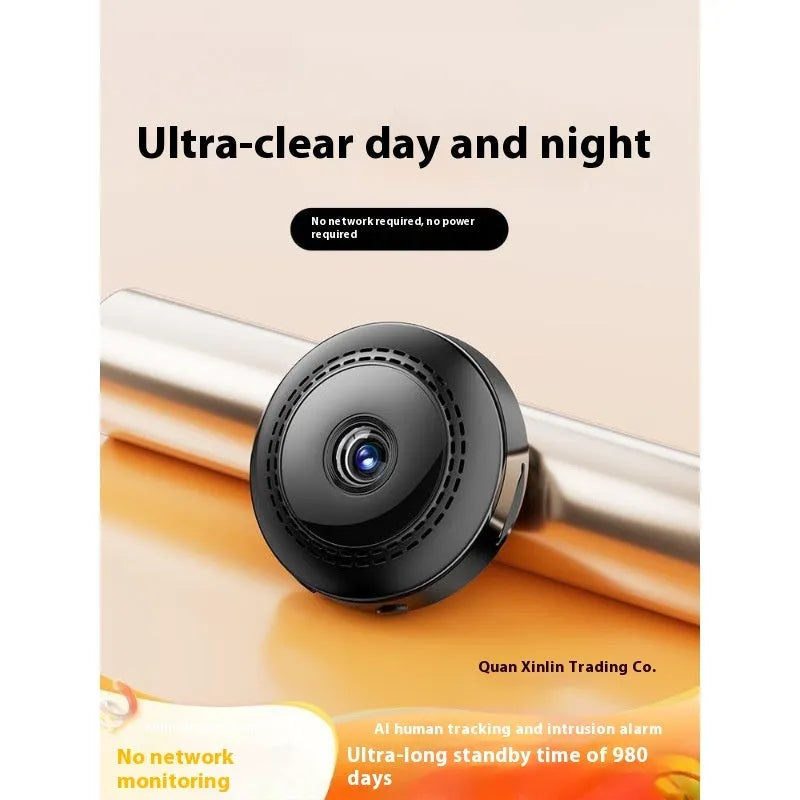 Wireless 360-degree rotating security camera on a table, showing circular design.