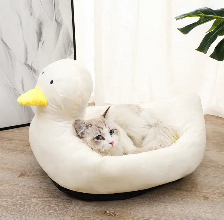 Blue duck-shaped pet bed sofa with soft polyester filling and raised edges