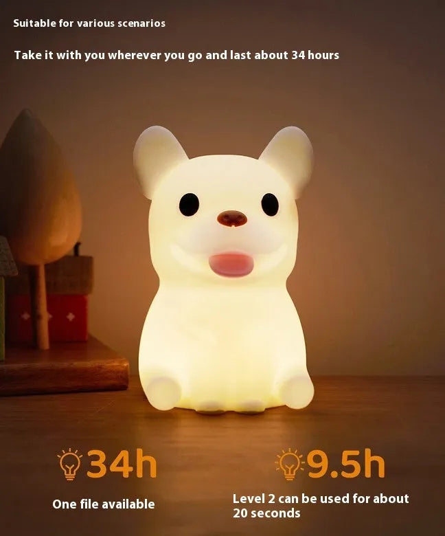 Silicone animal-shaped USB night light with touch dimming on a bedside table.