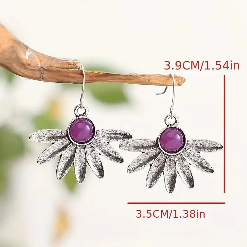Purple bohemian earrings with zodiac animal design and resin gemstone detailing
