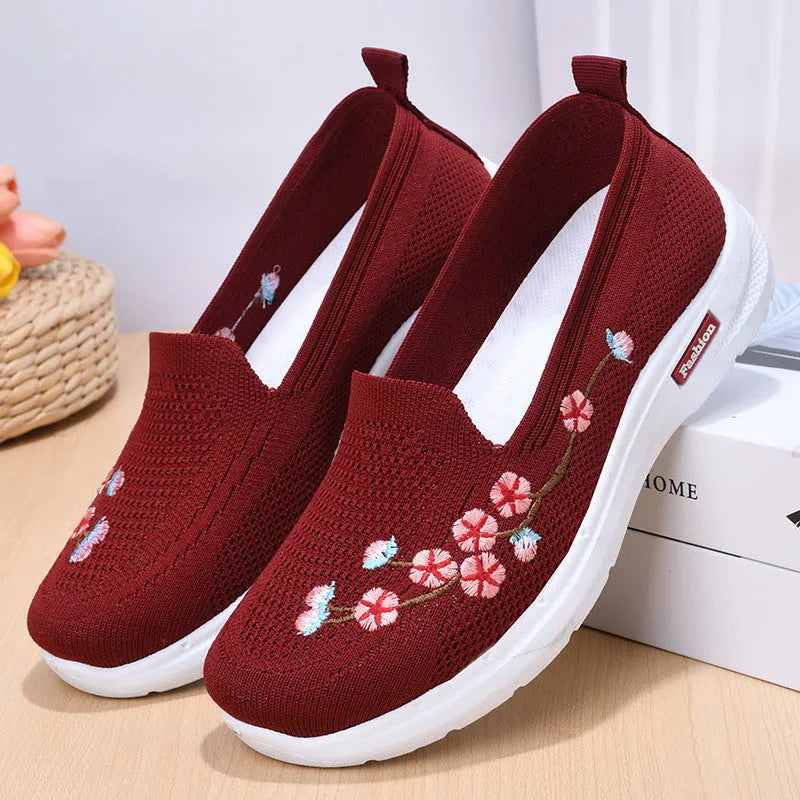 Women's wine red woven casual pumps with floral embroidery and a low anti-slip sole.