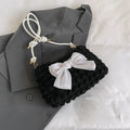 Women's canvas handbag with single shoulder strap in horizontal square shape showing mobile phone compartment