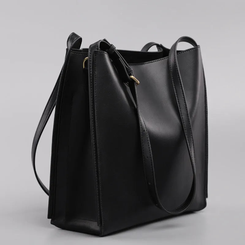 Brown genuine leather women's bucket bag with double shoulder straps and slit pocket