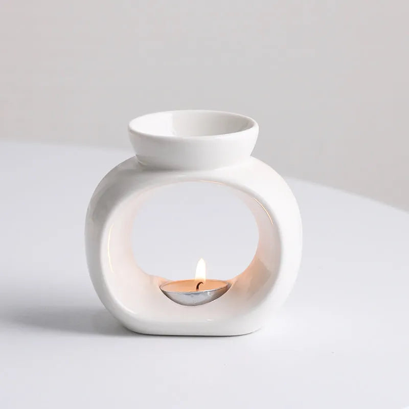 White Nordic style ceramic aromatherapy stove ornament on display