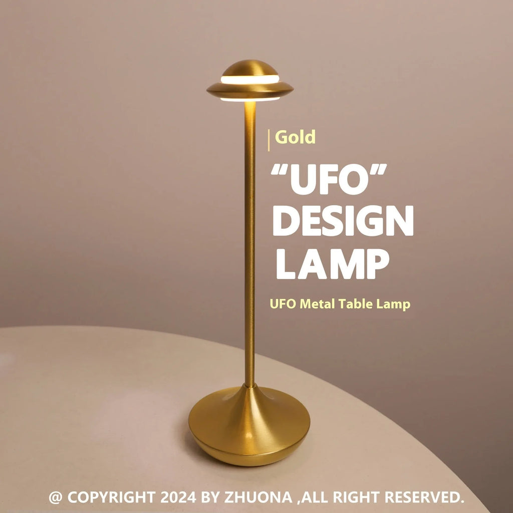 Modern metal UFO-shaped desk lamp in black on a wooden table, showing touch controls.