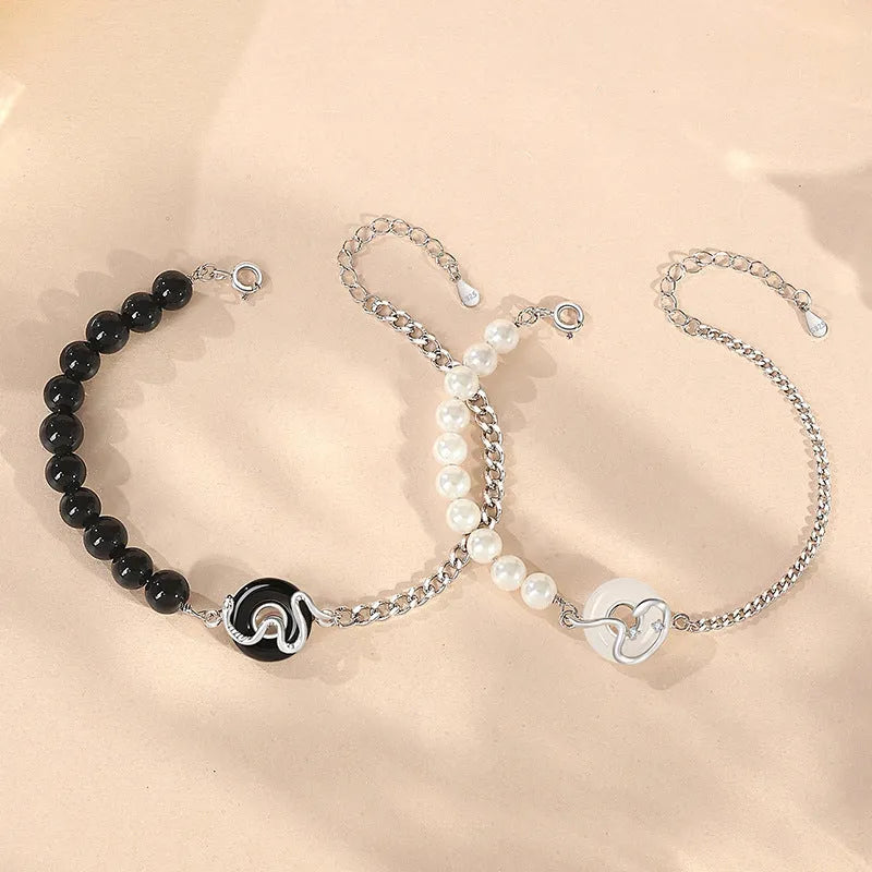 925 sterling silver couple bracelet with safety buckle, obsidian pearl, and Chinese zodiac snake design.