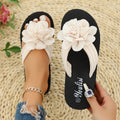 Solid-colour floral flip-flops with a lightweight EVA sole on a plain background.