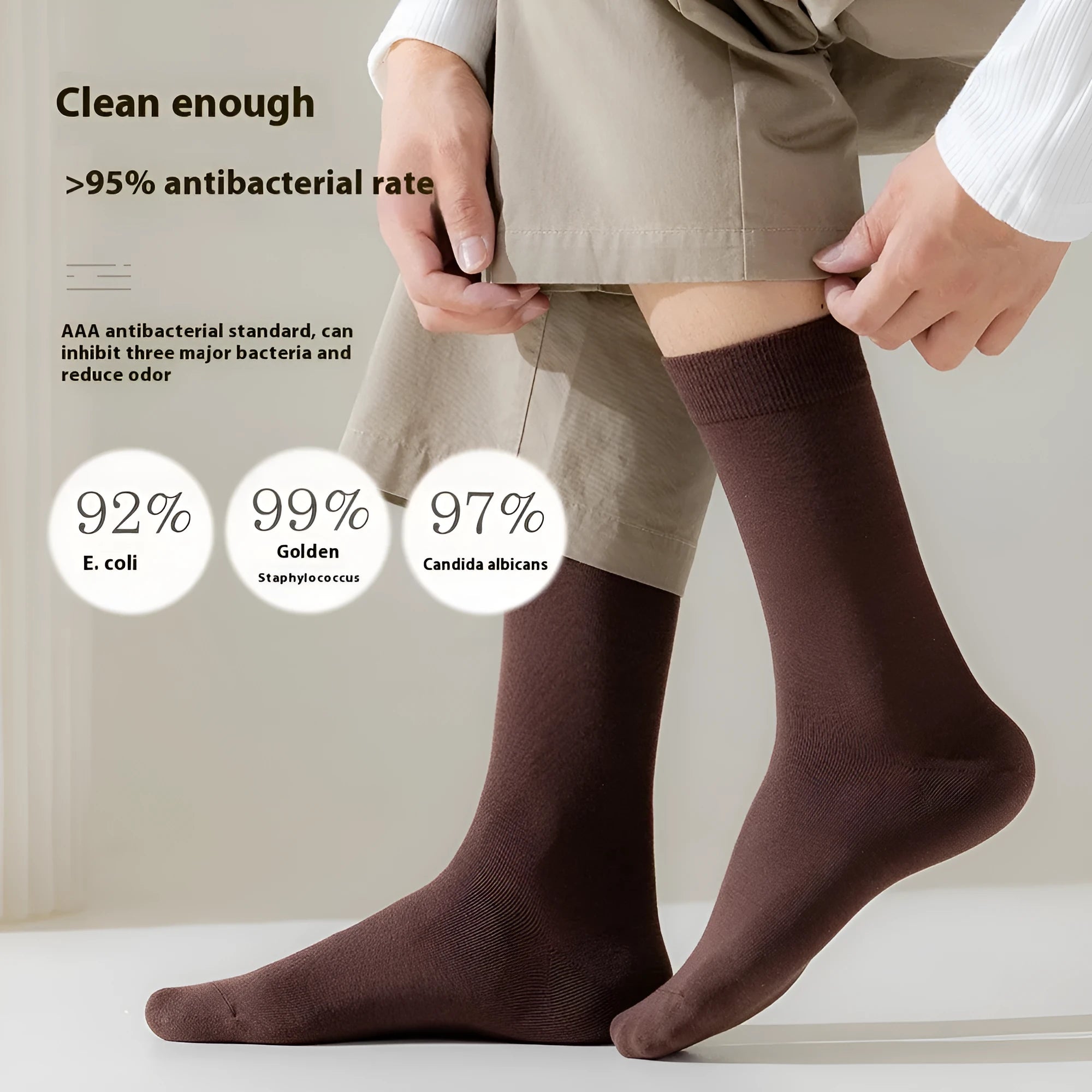 Men's mid-calf combed cotton socks in solid colours like army green, beige, and black on a white background.