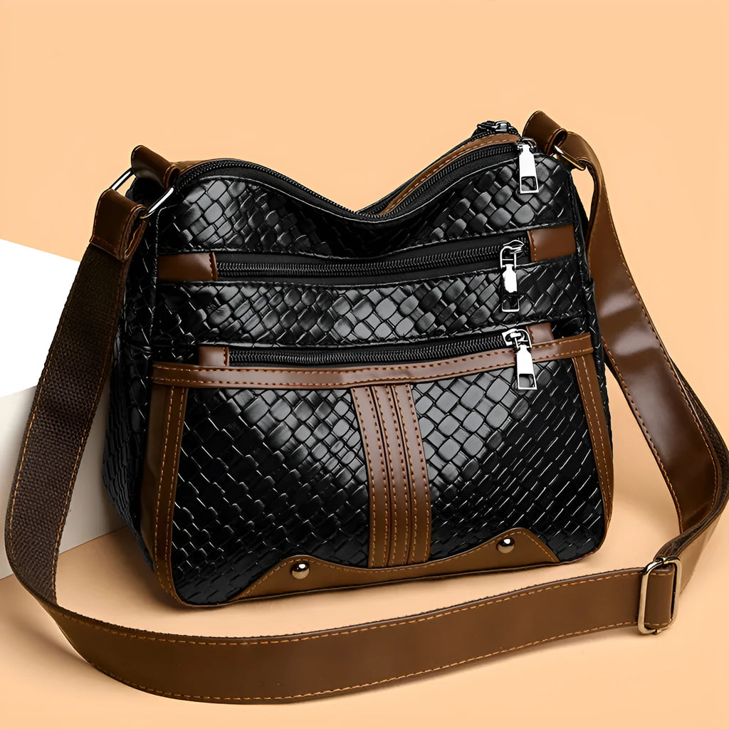 Woven single shoulder messenger bag in horizontal square shape with multiple compartments and PU leather construction