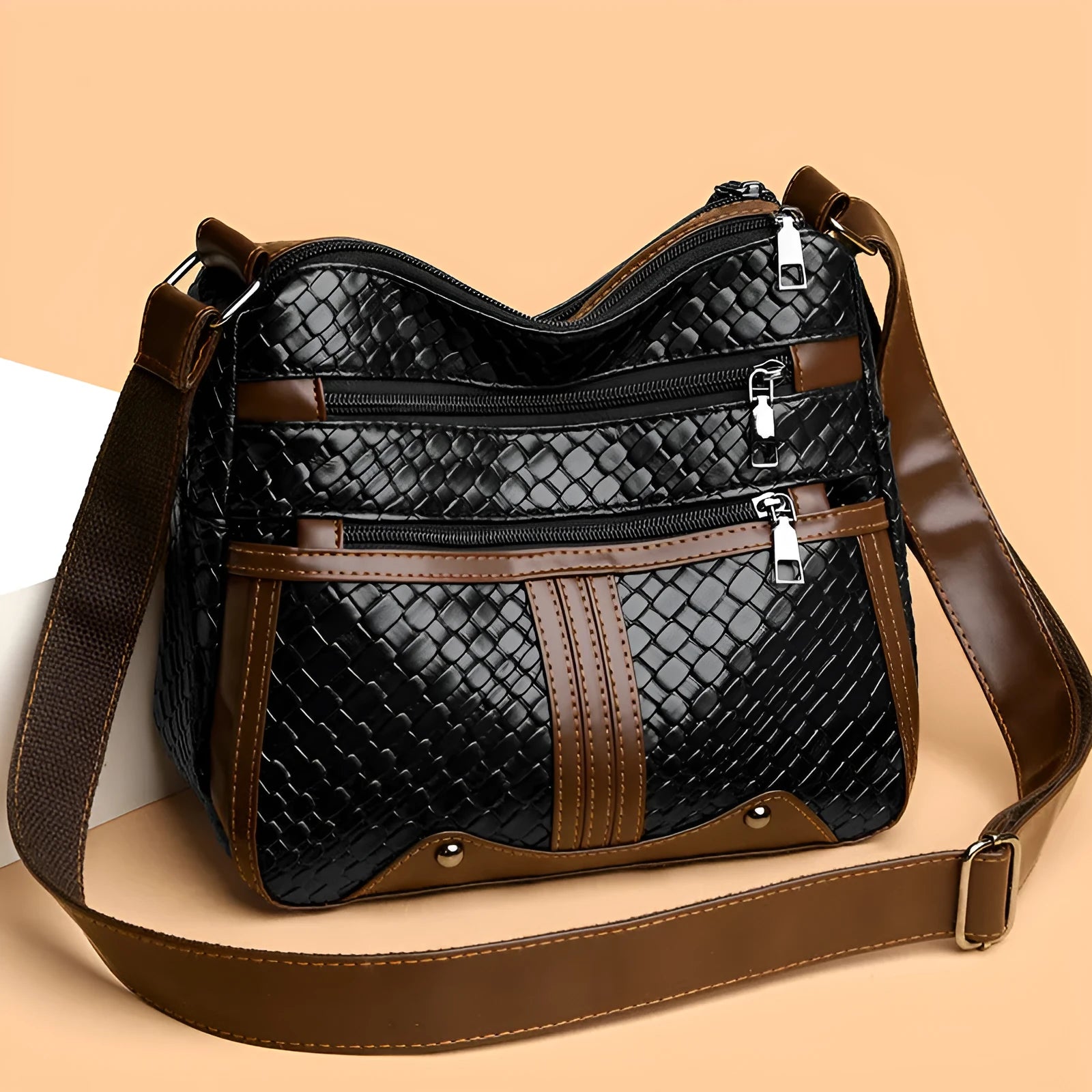 Woven single shoulder messenger bag in horizontal square shape with multiple compartments and PU leather construction