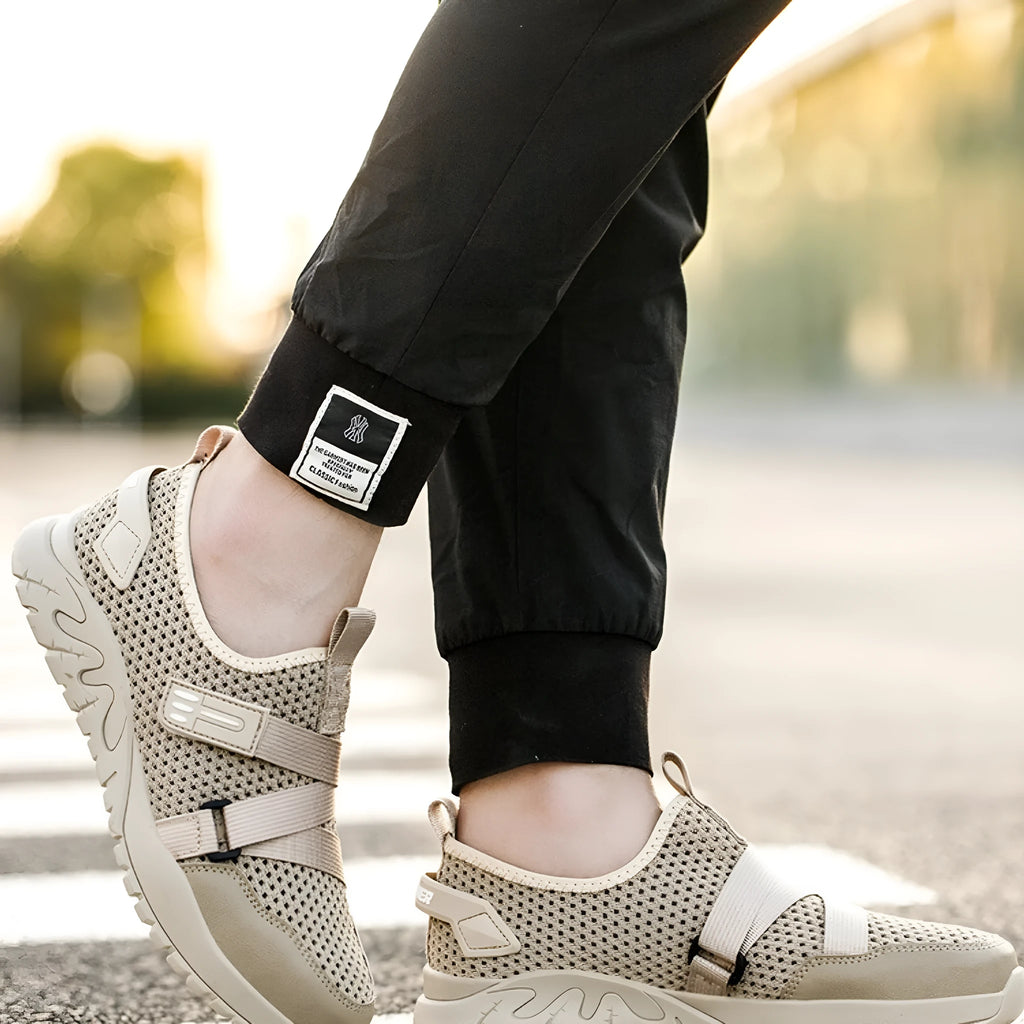 Men's grey anti-smash and anti-puncture insulation safety work shoe with a woven upper and rubber sole.