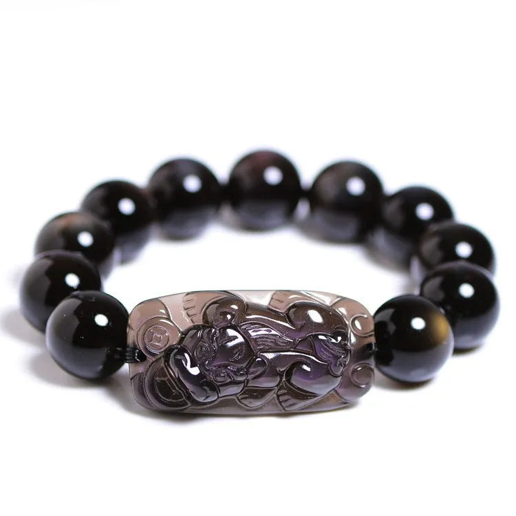 Polished crystal Pi Xiu bracelet with geometric ice stone beads on a wrist.