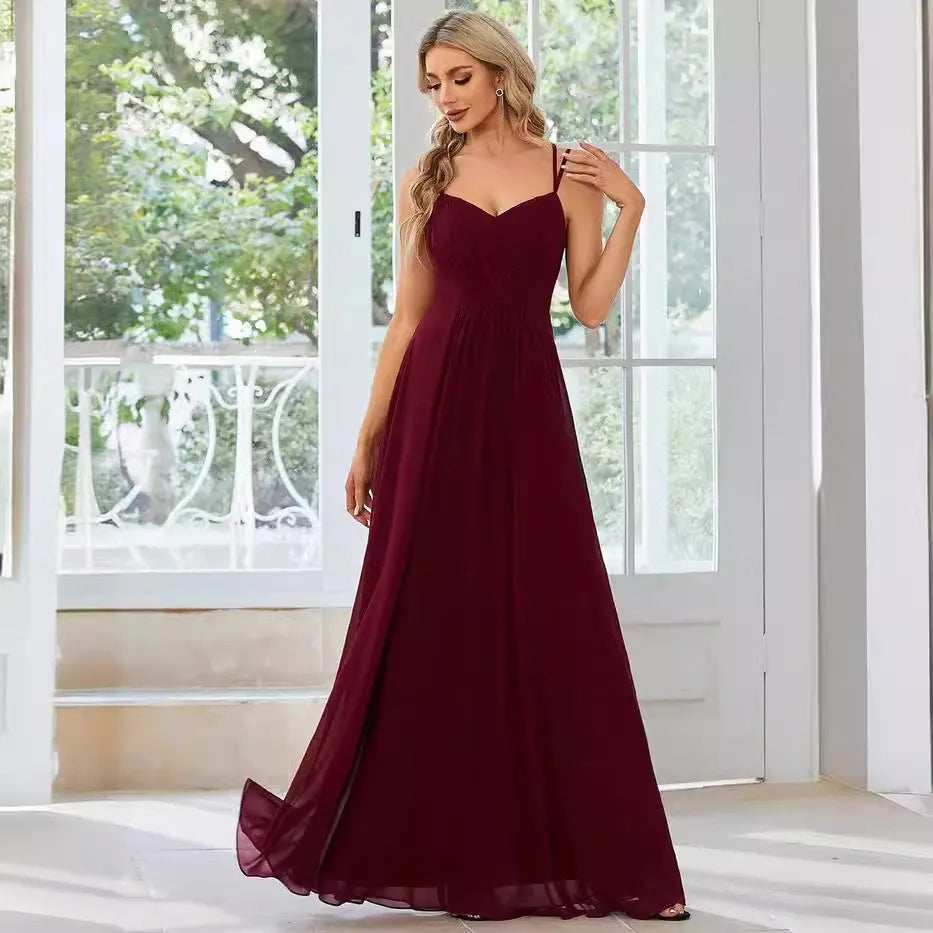 Women's sleeveless long pleated dress in an A-line silhouette, shown in a solid colour.