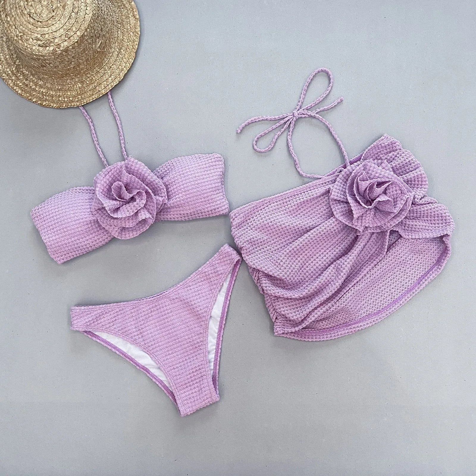 Women's 3D flower split bikini set in white or purple, includes skirt, bra, and briefs.