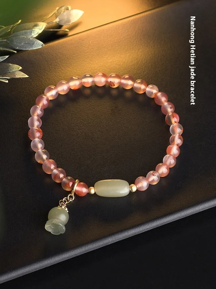 Agate ethnic bracelet with flower shape and bamboo joint design in Hetian Jade colour.