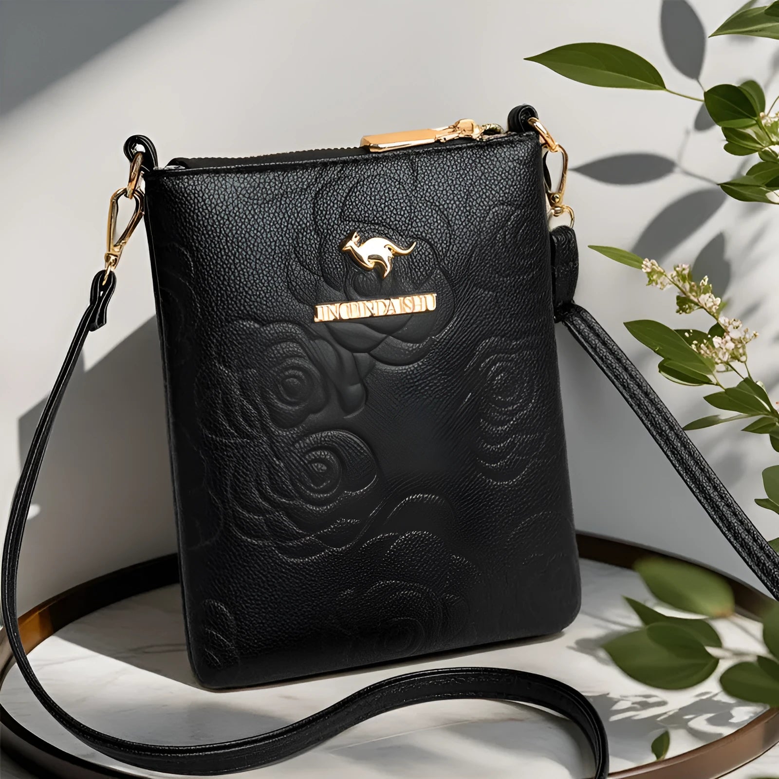 Soft PU leather shoulder messenger bag in a square vertical shape with a file compartment, shown in a floral stone pattern colour.