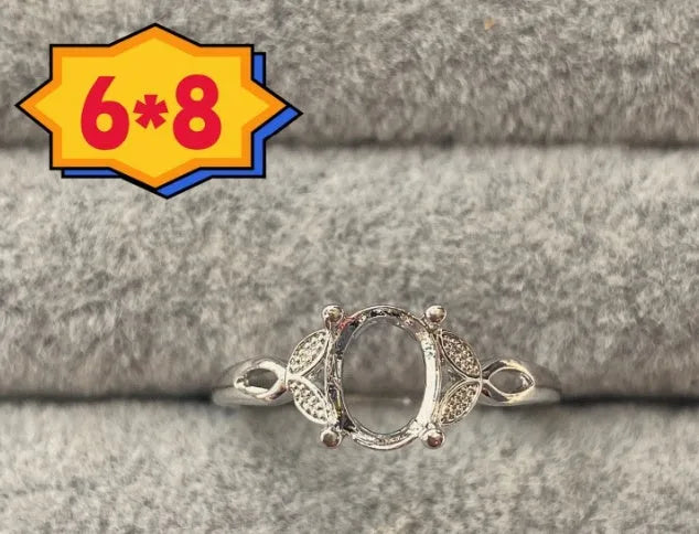 Oval denier ring with 6x8mm stone and five-pointed star detail on electroplated copper band