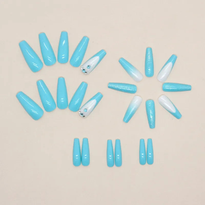 Solid colour artificial nails with long ballet shape and blue diamond glitter decoration