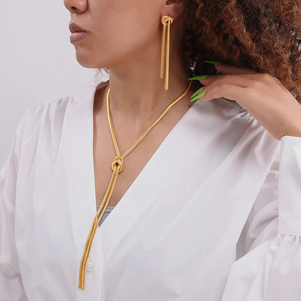 Gold electroplated titanium steel necklace with tassel pendant and matching earrings set
