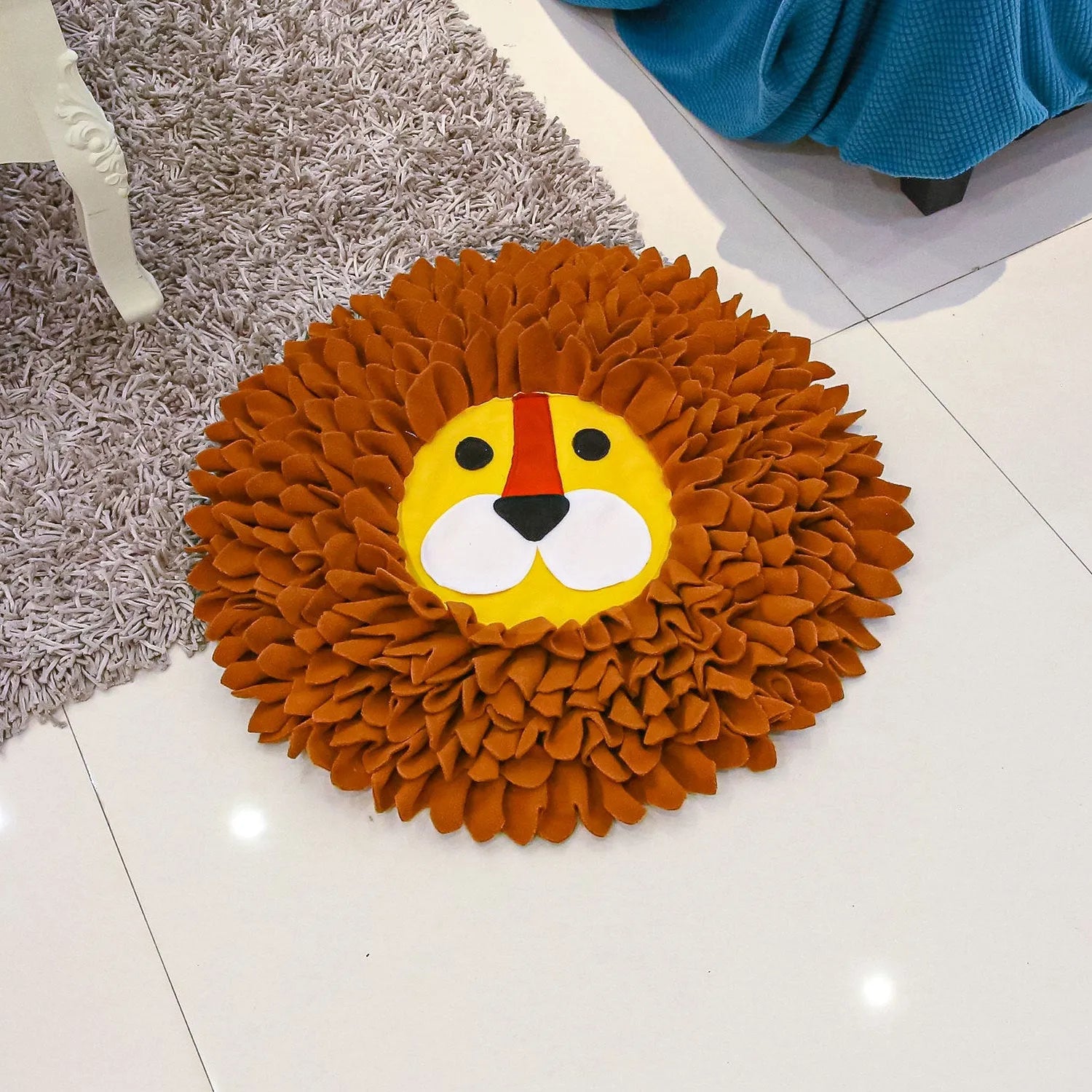 Brown lion-shaped sniffing pad for dogs and cats with textured surface for food hiding