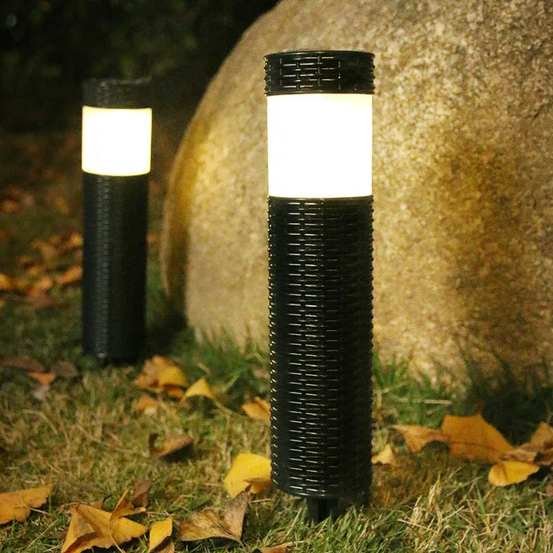 Outdoor garden light with abstract design and simulated flame effect for courtyard installation