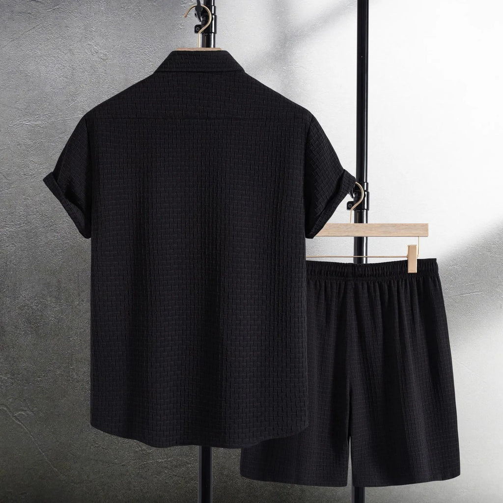 Men's casual short sleeve shirt and matching shorts set in black, laid flat.
