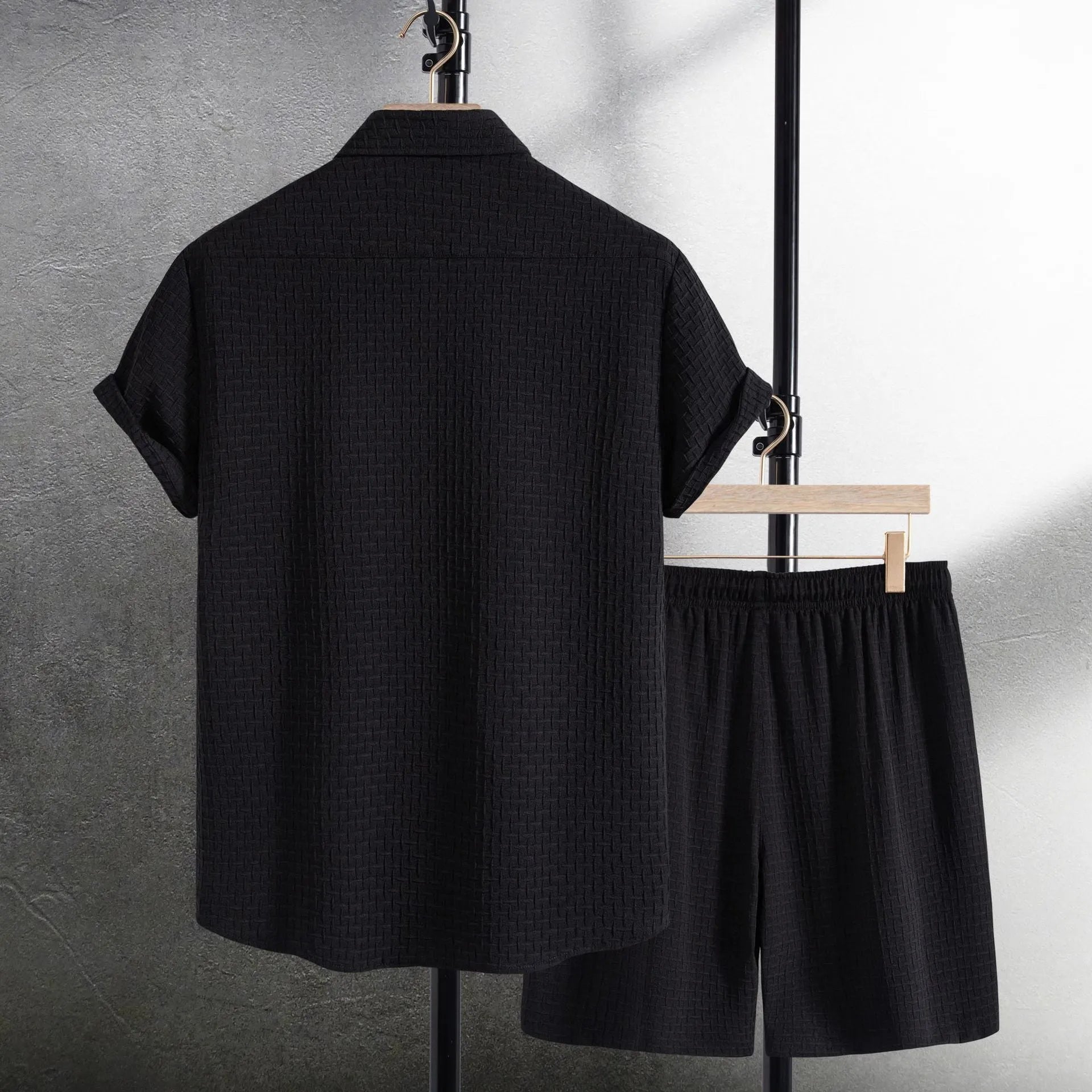 Men's casual short sleeve shirt and matching shorts set in black, laid flat.