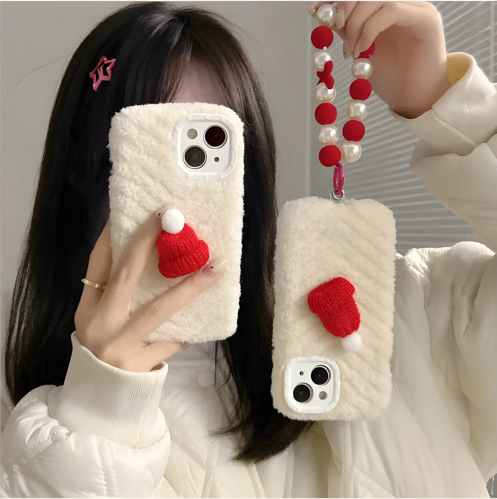 Red silicone iPhone back cover with attached plush Christmas hat bracelet