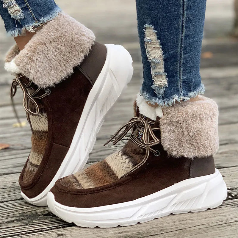 Women's beige lace-up snow boots with a suede upper and thick platform sole.