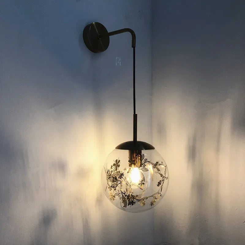 Modern glass wall lamp in golden flower finish with LED bedside lighting