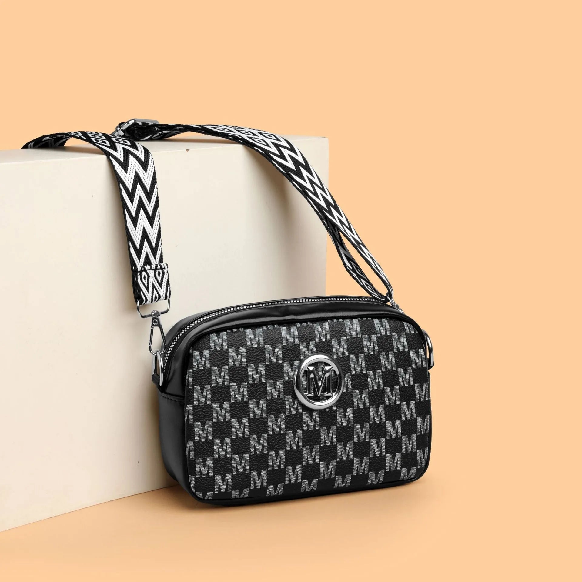 PU leather crossbody bag with wide shoulder strap and three-dimensional front pocket