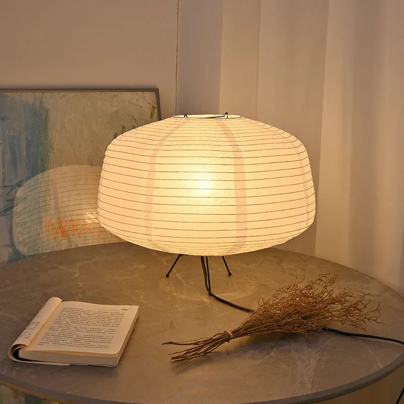 Japanese style xuan paper desk lamp with three-colour light source on a wooden desk in a bedroom