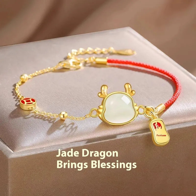 Women's silver-plated bracelet with Dragon zodiac motif and central Hetian jade stone.