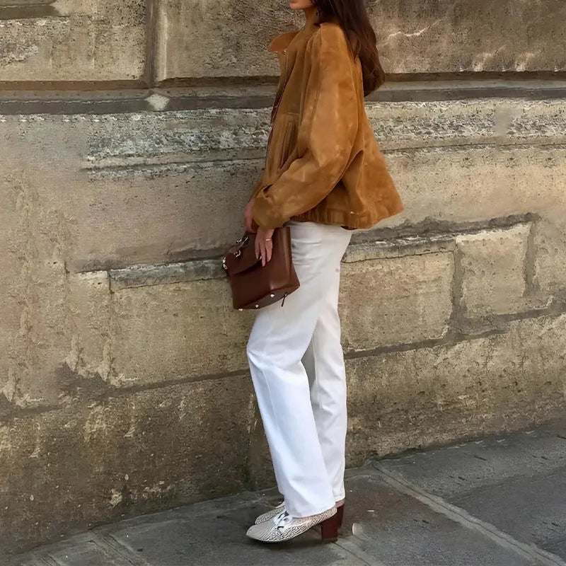 Man wearing a solid colour loose-fit retro style polyester jacket