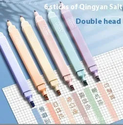 Set of six double-headed fluorescent highlighter pens with assorted barrel colours on a white surface.