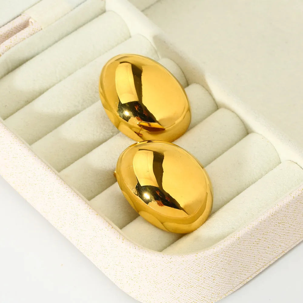 Geometric stainless steel earrings with glazed surface and line elements in gold colour DFE139