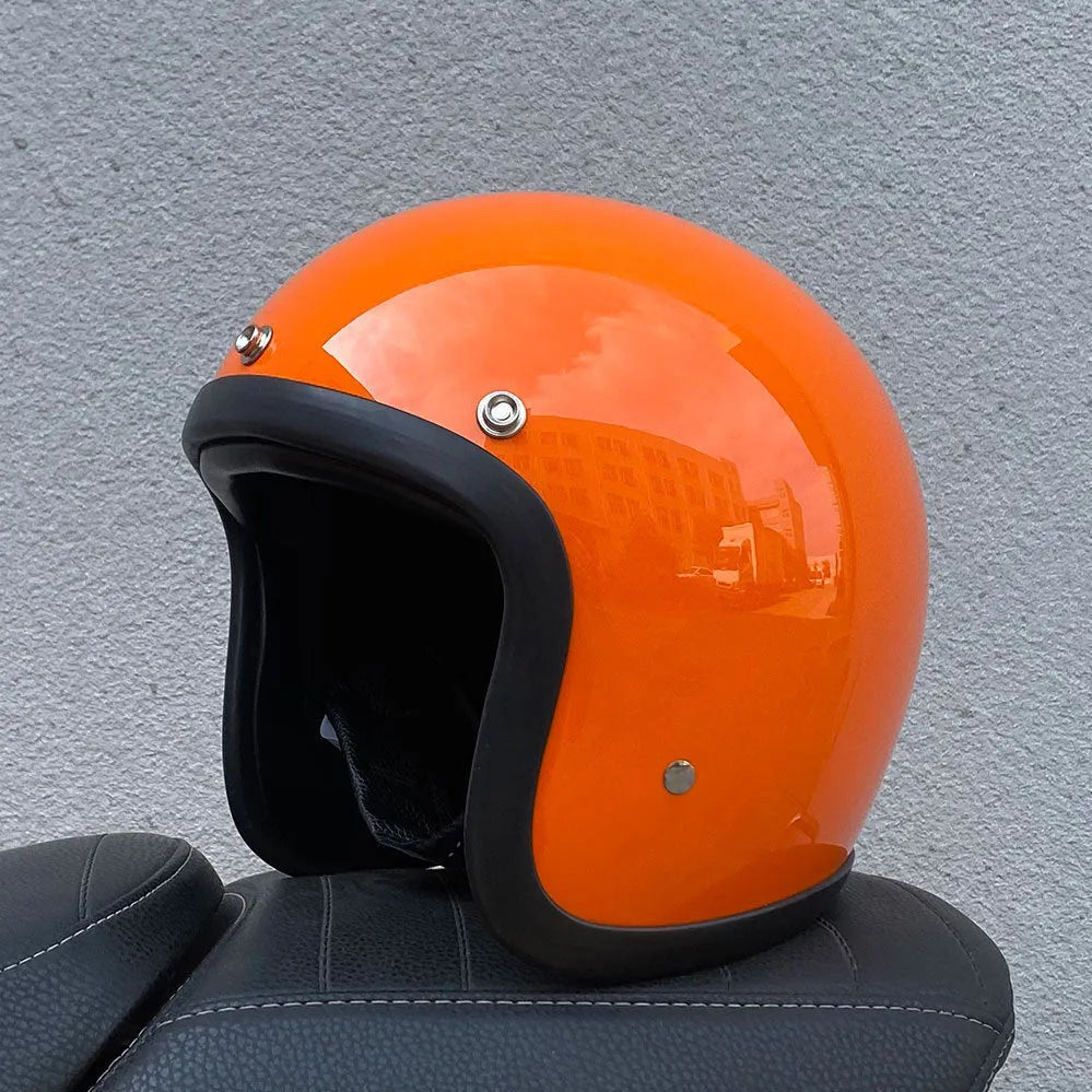 A retro-style fibreglass half motorcycle helmet shown in a cement grey colour, suitable for adult commuting.