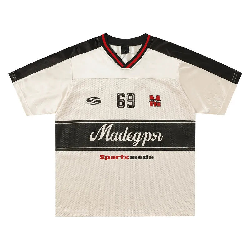 Apricot-coloured loose fit sports T-shirt with a printed letter design and drop-shoulder sleeves.
