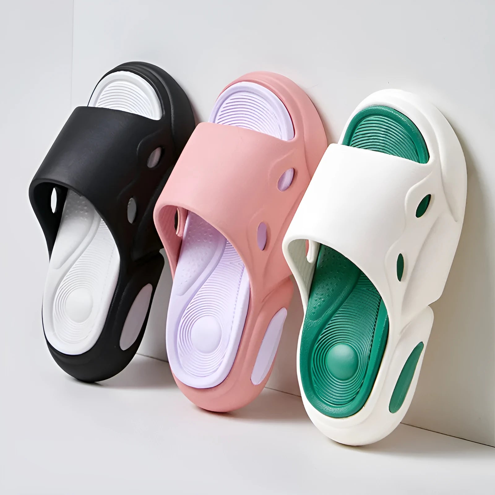 Two-colour thick-soled EVA slippers with leather lining in pink purple, white green, and black white colour options.