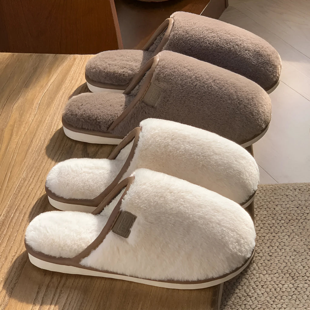 Pair of solid colour plush PVC winter slippers with non-slip soles for home use.