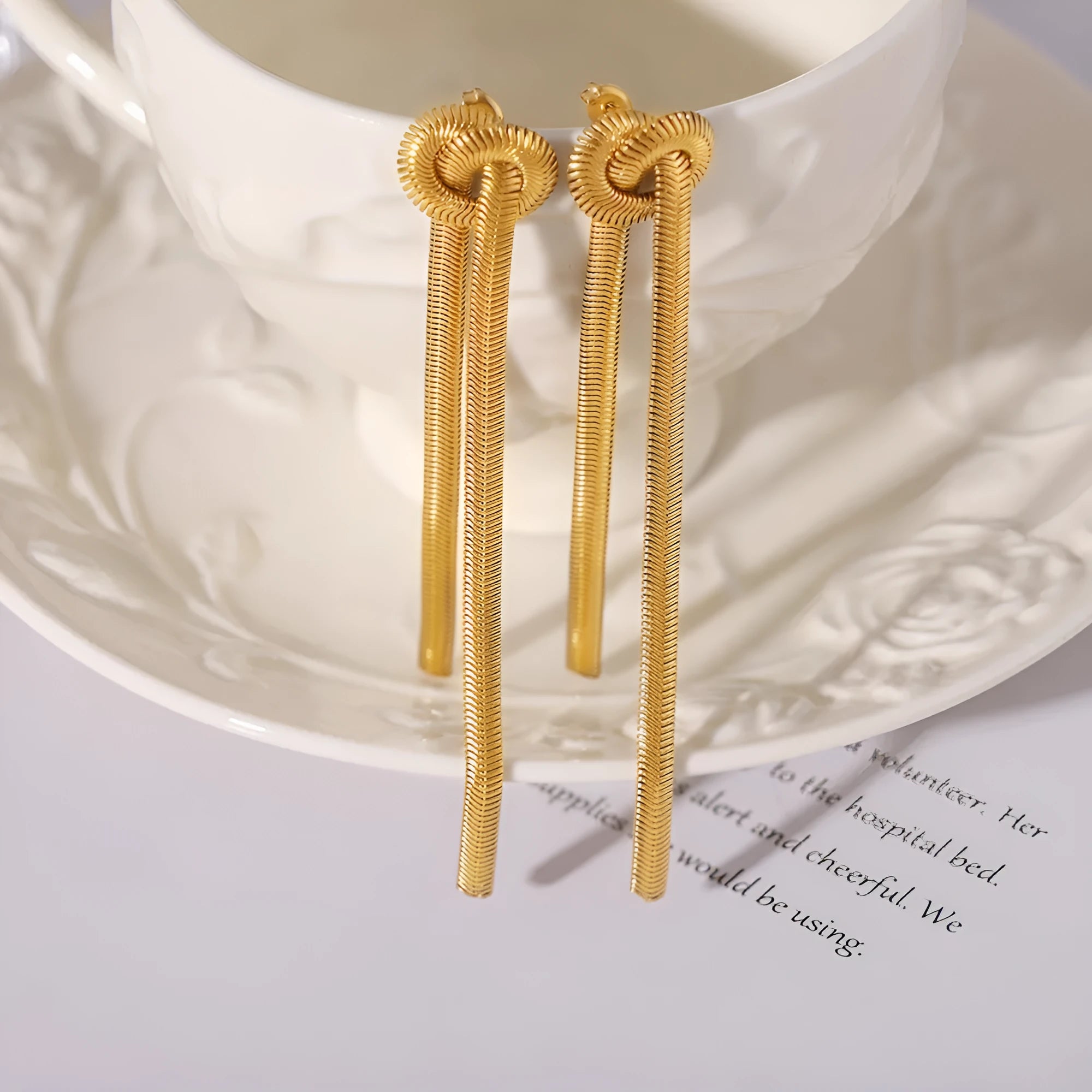 Gold electroplated titanium steel necklace with tassel pendant and matching earrings set