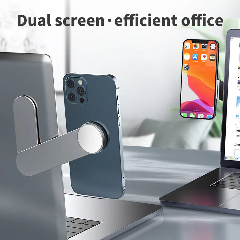 Silver aluminium alloy dual screen extension bracket with magnetic mobile phone holder on a desk.