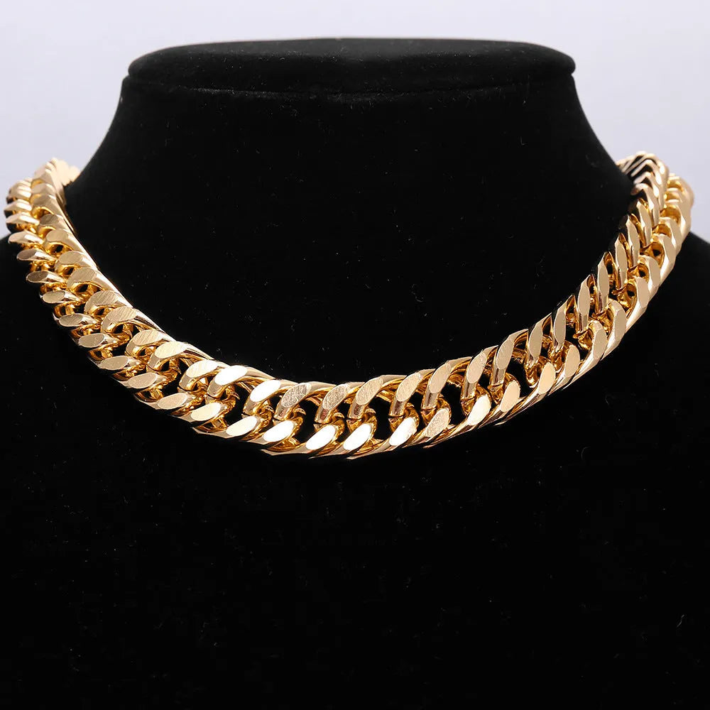 Gold tone thick chain women's necklace on a white background, showing the clasp and extender.