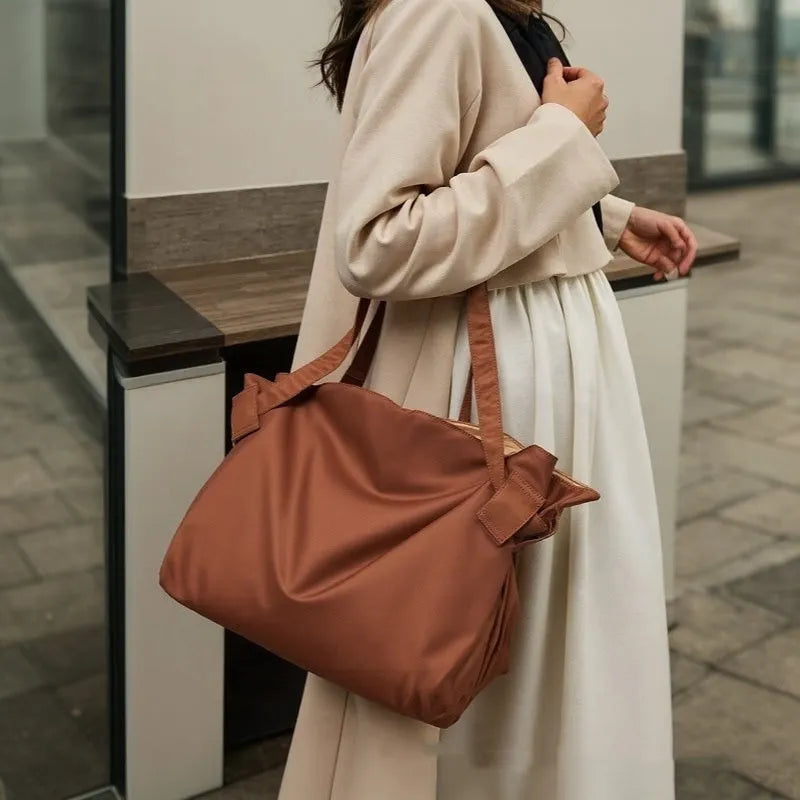 Women's waterproof Oxford cloth shoulder bag in black or light brown for travel camping and daily urban use