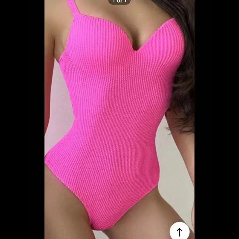 Women's black sleeveless one-piece swimsuit made from polyester fabric on a mannequin.
