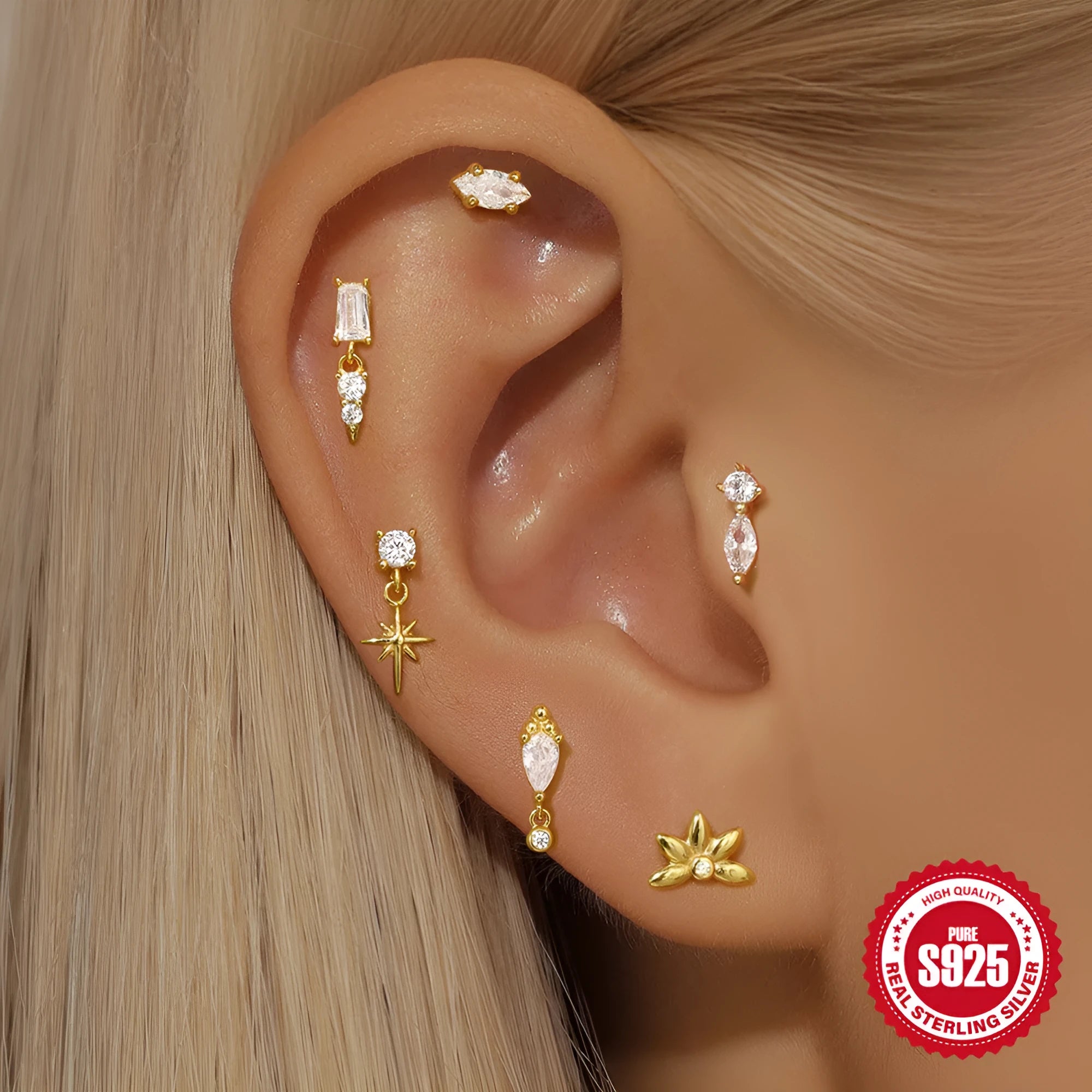 S925 sterling silver piercing ear stud with gold tone finish and XINGX inlaid tassel design
