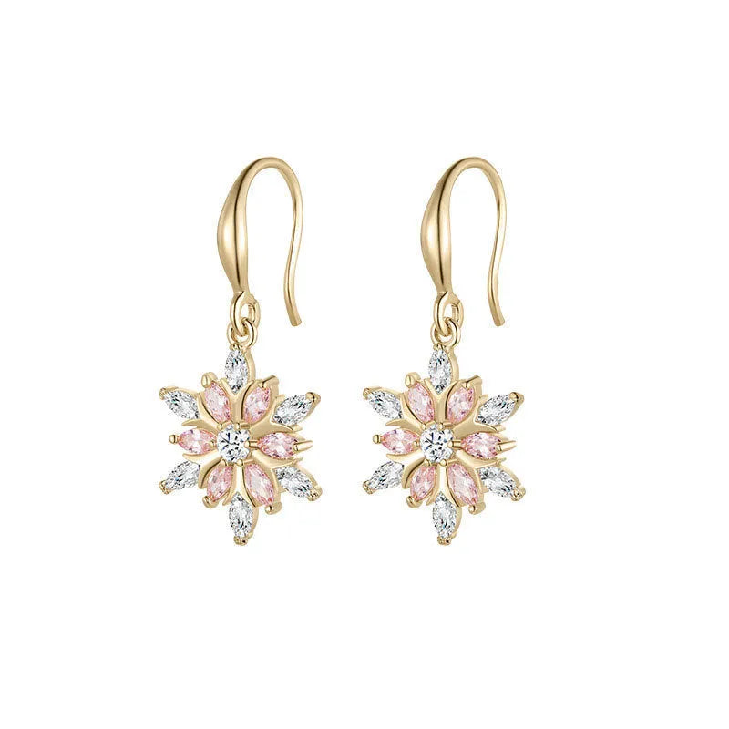 Gold snowflake earrings with zircon stones on alloy base, geometric design for women